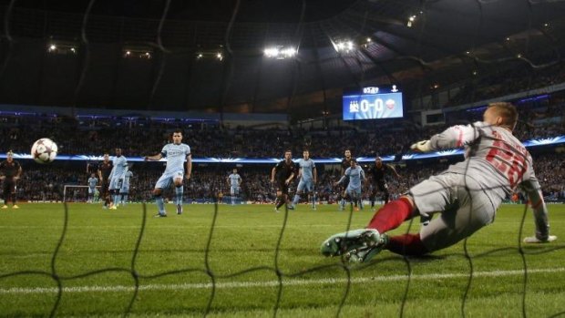 Manchester City's Sergio Aguero finds the net from the penalty spot.