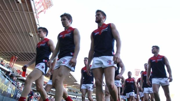 The Demons walk off after losing to Greater Western Sydney.