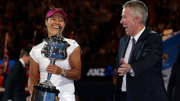 Australian Open director Craig Tiley (right) with Li Na of China after her victory in the women's singles final on Saturday night.