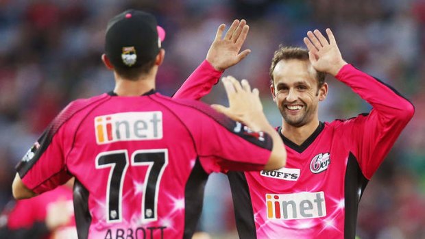 No hard feelings: Sixers players Sean Abbott (left) and Nathan Lyon celebrate dismissing Mike Hussey of the Thunder on Saturday.