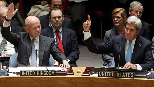 Unanimous: British Foreign Secretary William Hague and US Secretary of State John Kerry vote.