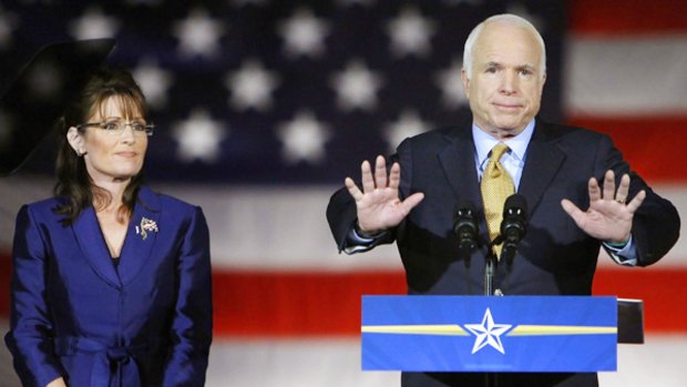 Defeated Republican presidential candidate John McCain, with his vice-presidential nominee Sarah Palin, during his concession speech to supporters in Phoenix.