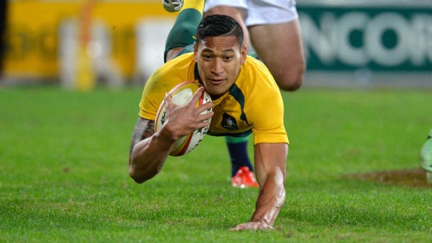 One that got away: Salary cap issues forced Israel Folau to rugby after Parramatta were unable to strike a deal with the player and NRL. Folau scored in his Wallabies' debut on Saturday.