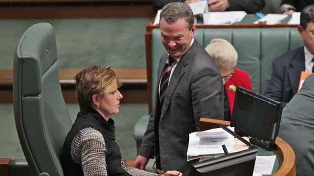 Manager of Opposition Business Christopher Pyne walks by Acting Speaker Anna Burke during a Question Time in August.