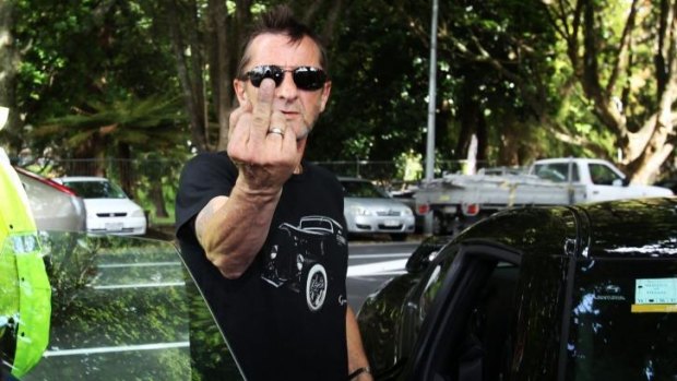 "He's not the Phil we've known": AC/DC drummer Phil Rudd gestures after appearing in Tauranga District Court charged with threatening to kill and possession of meth and marijuana in November.
