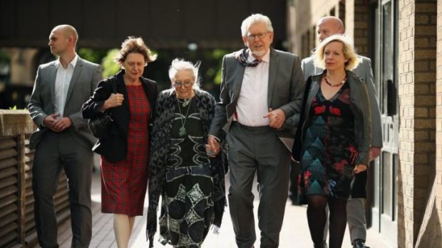 Rolf Harris leaves Southwark Crown Court with his wife Alwen Hughes (his right) and daughter Bindi (his left).