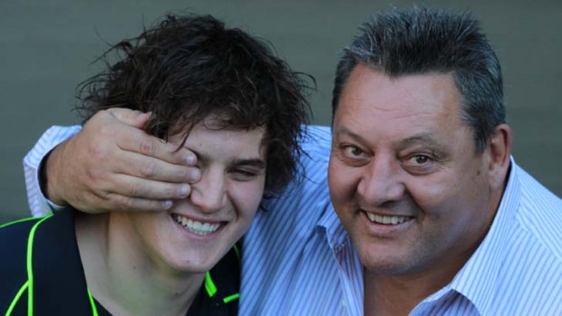 Australian Olympic water polo player AJ Roach with his father, NRL great Steve "Blocker" Roach.