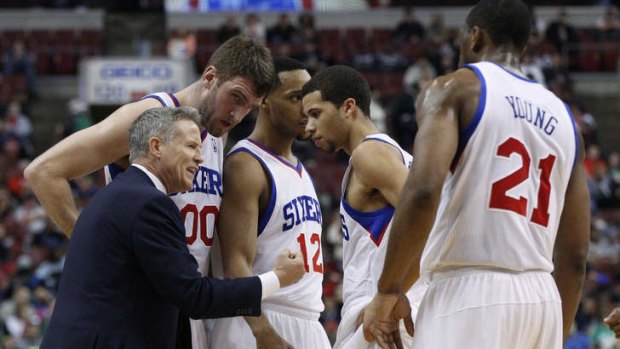 Philadelphia 76ers coach Brett Brown talks things over with his team; (left to right) Spencer Hawes, Evan Turner, Michael Carter-Williams, and Thaddeus Young during the first half against the Boston Celtics in Philadelphia.