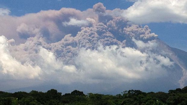 Plumes of smoke rise from the Volcan de Fuego or Volcano of Fire as seen from Palin, south of Guatemala City.