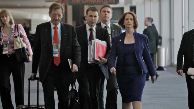 Salary hikes ... Prime Minister Julia Gillard with the head of her department Dr Ian Watt, left, will receive significant raises.