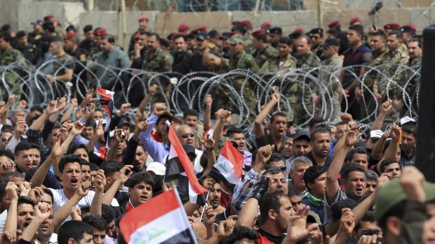 Iraqi protesters outside the heavily fortified Green Zone in Baghdad.