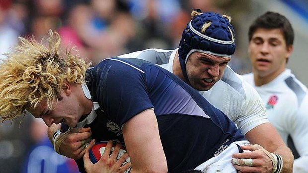 England flanker James Haskell tackles Scotland lock Richie Gray.