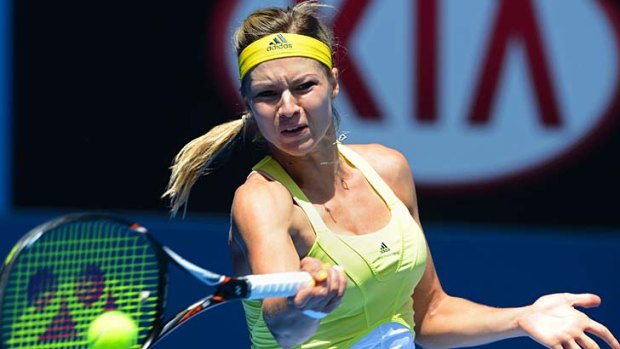 Gear change &#8230; Maria Kirilenko wears a yellow bandanna on Saturday after she was told her visor breached branding regulations.