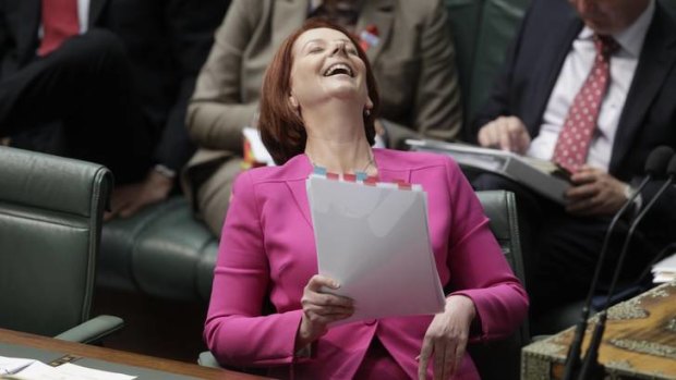 Prime Minister Julia Gillard reacts as Opposition Leader Tony Abbott addresses AWU allegations against her in parliament.