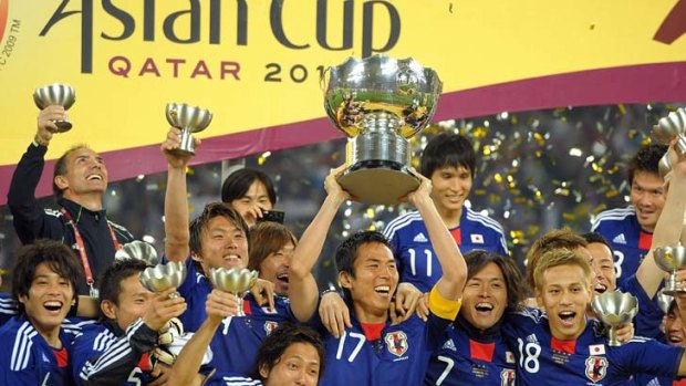 Grinners ... The Japanese team celebrate winning the AFC Asian Cup Final against the Socceroos in January.