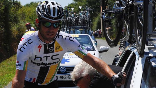 Mark Cavendish has his bike checked by a mechanic during an unhappy stage 3 for the British rider.