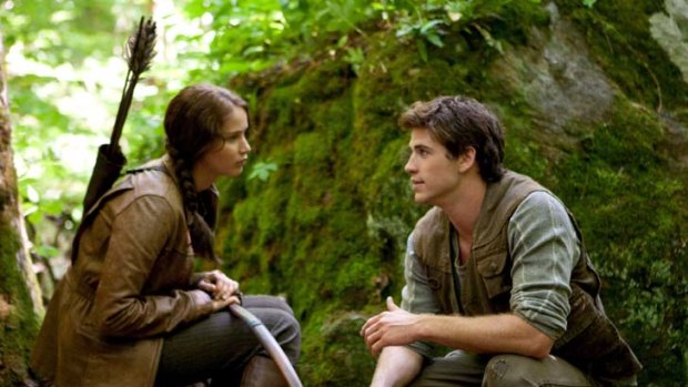 Hunter-gatherers ... the survival of Katniss (Jennifer Lawrence) and Gale (Liam Hemsworth) depends on vigilance.