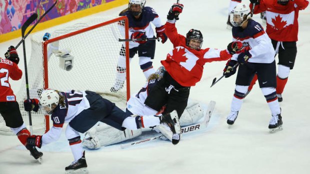 Canada's women's ice hockey team win the gold in a thriller against United States.