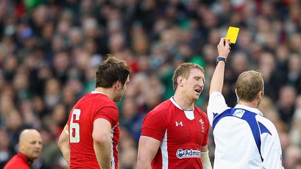 Tip tackle ... Bradley Davies of Wales is shown the yellow card by referee Wayne Barnes.