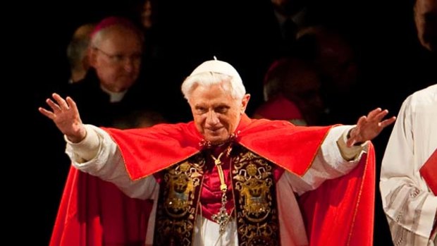 Pope Benedict XVI blesses faithful as he leads the Way of the Cross (Via Crucis) on Good Friday.