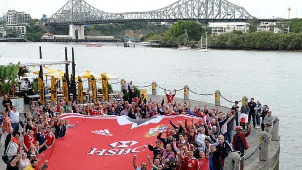 A giant British and Irish Lions jersey pictured with fans beside the Brisbane River ahead of the first Test at Suncorp.