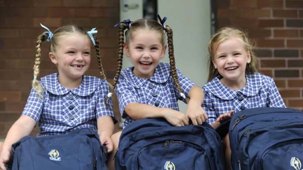 Prepped, plaited and packed to go ... cousins Demi Bresnahan, Mia Toohey and Jasmine Rose will start school together at Our Lady of Fatima in Caringbah.