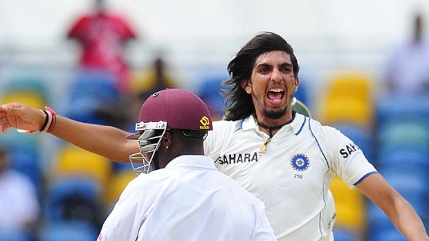 Indian bowler Ishant Sharma celebrates taking the last West Indies wicket of Fidel Edwards.