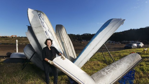 Sculptor Sandy Bliim with her Sydney Opera House, made of boat hulls. 