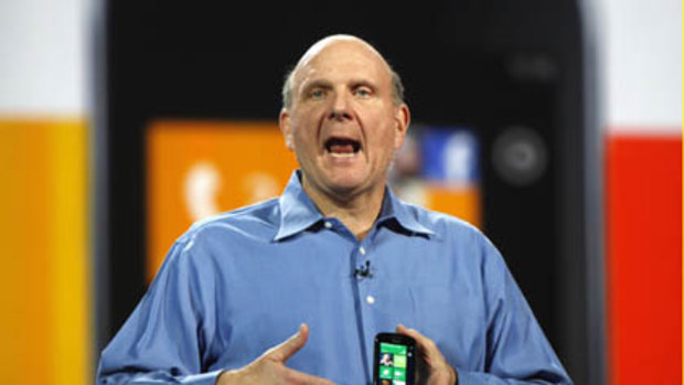 Microsoft CEO Steve Ballmer holds a Windows 7 phone during his keynote address on the eve of the Consumer Electronics Show in Las Vegas.