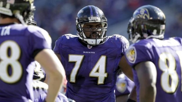 The real Michael Oher (74) playing for the Baltimore Ravens.