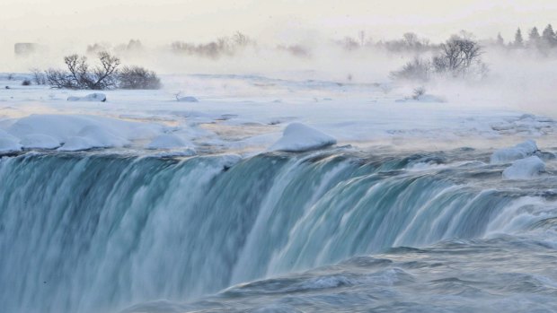 Pieces of ice flow over the Canadian 'Horseshoe' Falls in Niagara Falls.