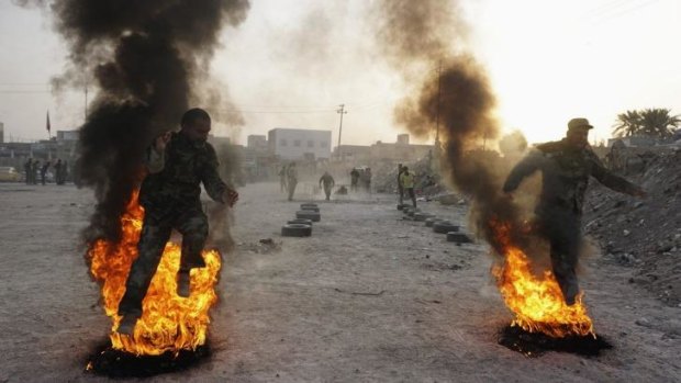 Sectarian fires: Shiite volunteers for the Iraqi army undergo training in the southern Iraqi city of Najaf.