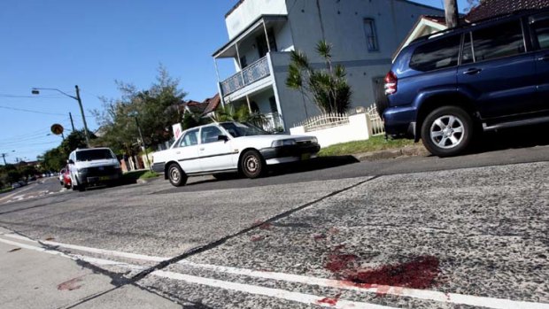 Family gathering turned deadly ... Sunday's altercation left bloodstains on the road outside the Marrickville home.