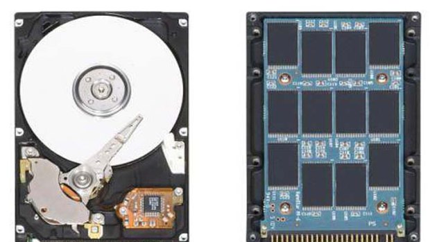 A traditional hard drive, left, stores files on spinning platters, whereas new solid-state drives, right, store files on memory chips.