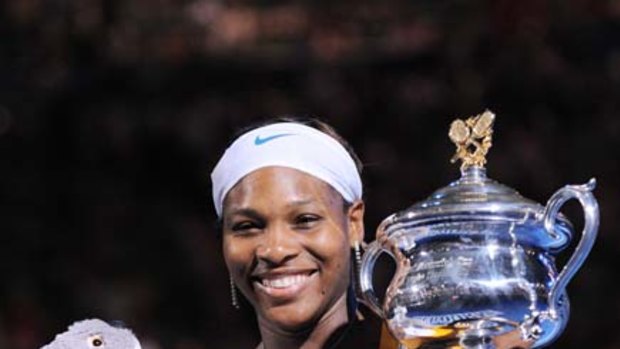 Recovery ... Serena Williams with the 2010 trophy, her fifth Australian Open win.
