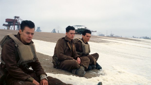 Harry Styles, from left, Aneurin Barnard and Fionn Whitehead in a scene from "Dunkirk." 