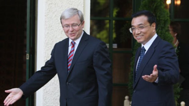 Helping hand ... the Prime Minister, Kevin Rudd, with China’s Vice-Premier, Li Keqiang, who is keen to ‘‘reduce mistrust’’ between the two nations.