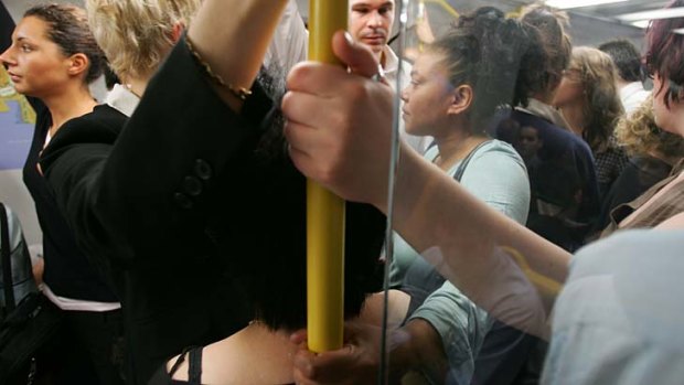 Feel the crush: Melbourne commuters on a crowded train.