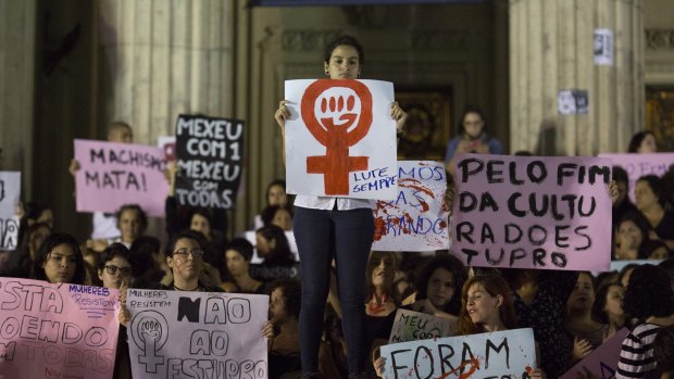 Demonstrators protest the gang rape of a 16-year-old girl in Rio de Janeiro, Brazil.