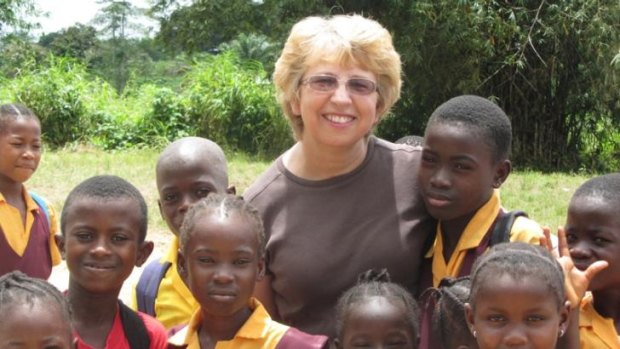 Nancy Writebol, with children in Liberia,l is one of two Americans working for a missionary group in Liberia that have been diagnosed with Ebola.