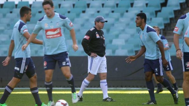 Business as usual: Frank Farina runs Sydney FC through drills at Allianz Stadium on Thursday.