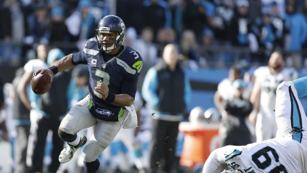 Comeback: Russell Wilson's Seahawks got within seven points of Carolina after trailing 31-0 but it wasn't enough.