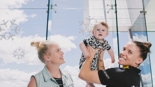 Canberra Capitals captain Nat Hurst with her wife Tara and their son Nash 6-months-old. 
