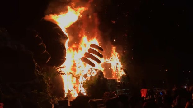 Footage shows the giant gorilla statue going up in flames at the Vietnamese movie premiere. 