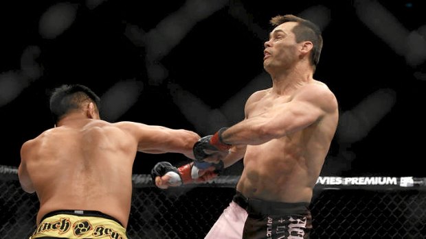 Rich Franklin (right) is hit by Cung Le during their UFC middleweight bout in Macau.
