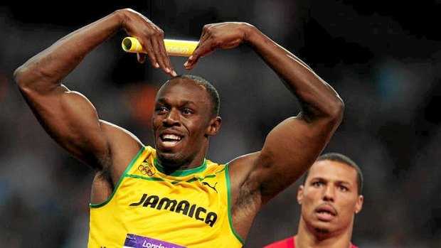 Usain Bolt channels Mo Farah as he crosses the finish line to win the men's 4 x 100m relay at the London Olympics.
