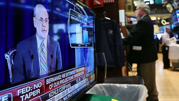 No movement: US Federal Reserve Chairman Ben Bernanke announces the news.