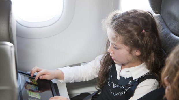 Airlines, including Jetstar (pictured), are looking at tablet computers as alternatives to installing costly, heavy, in-flight entertainment systems.