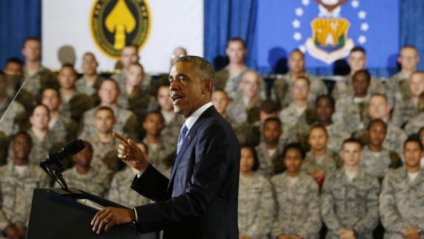 Copping flak from military leaders ... Barack Obama explains the US strategy for degrading and defeating Islamic State militants without sending ground forces back into Iraq in front of American soldiers.