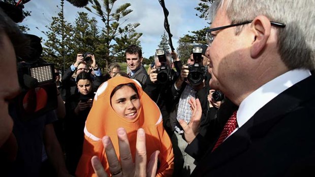 Looking for a little love for climate change policy: Kevin Rudd with a clown fish protester.